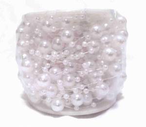 Pärlor på tråd med vita pärlor. 15 m