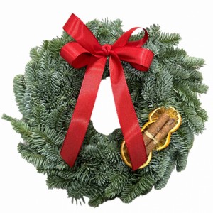 Krans med rosett,kanel och apelsinskivor