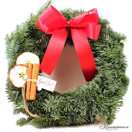Krans med rosett, kanel, äpple och etikett
