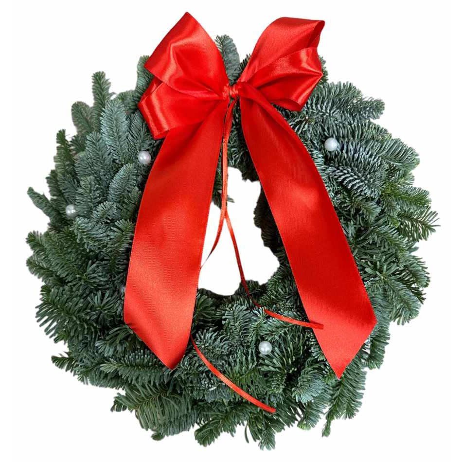 Krans med vita pärlor och röd rosett