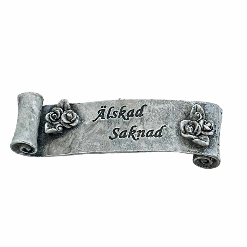 Banderoll med texten Älskad Saknad