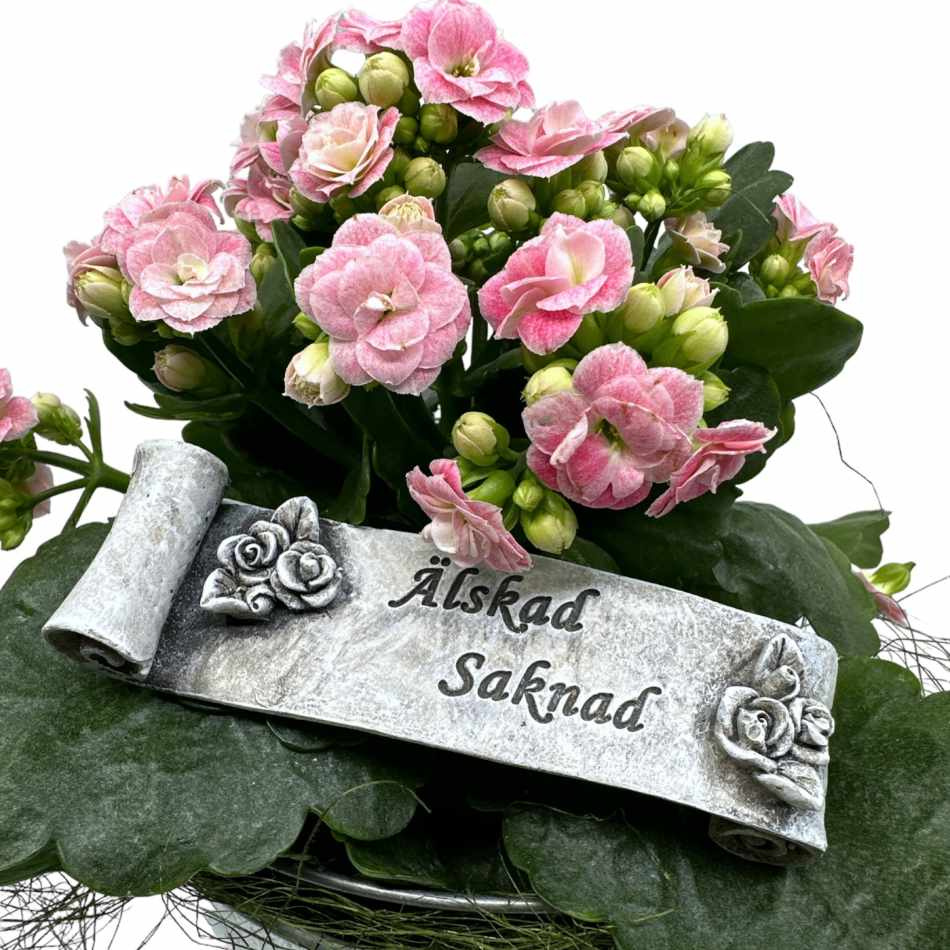 Banderoll med texten Älskad Saknad