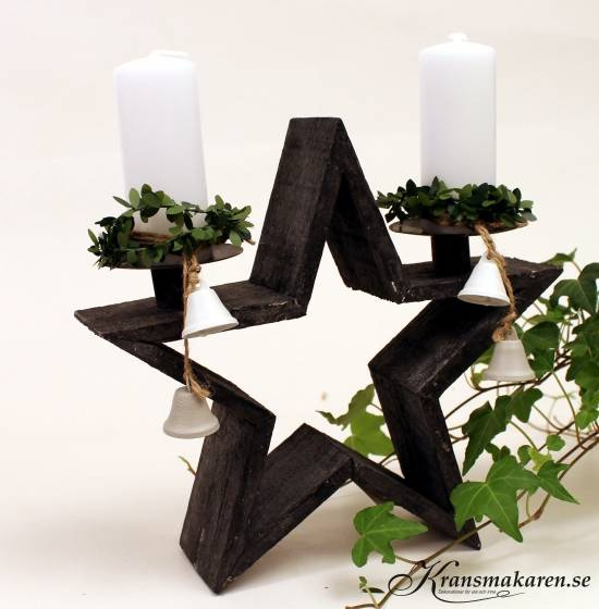 Stjärnformad ljushållare för 2 ljus. Grå. 25 x 7,5 cm