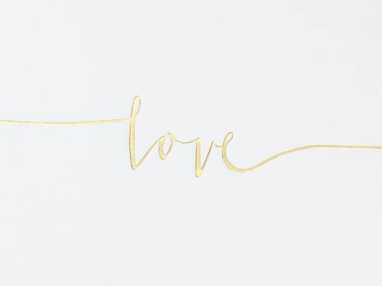 Guldfärgad text på gästbok